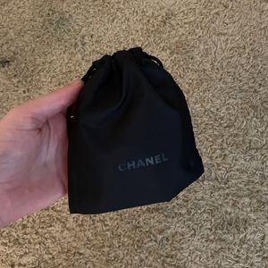 Tiny black Channel bag